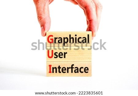GUI graphical user interface symbol. Concept words GUI graphical user interface on wooden blocks on a beautiful white background. Business and GUI graphical user interface concept. Copy space.