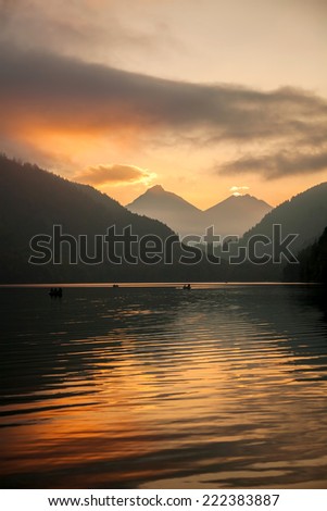 Schwangau lake in Bavaria Alps against sunset, Germany