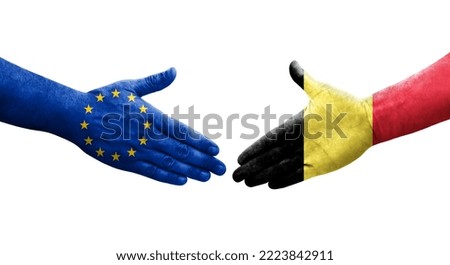 Handshake between Belgium and European Union flags painted on hands, isolated transparent image.