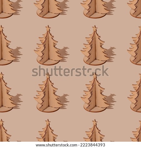 pattern of wooden Christmas trees on a beige background. new year, christmas background