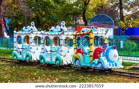 children's attraction steam train in the autumn park