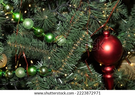 Multi-colored Christmas balls, garlands and toys on the New Year and Christmas tree. ?lose up