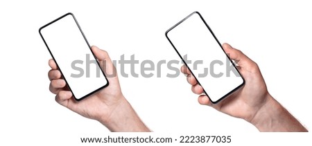 Man hand holding the black smartphone blank screen with modern frameless design, isolated on white background.