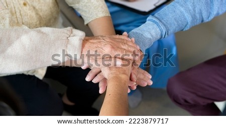 Top view of Seniors people holding  hands together in elder health  care center  , concept of old people health care , group therapy . 