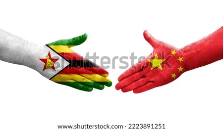 Handshake between China and Zimbabwe flags painted on hands, isolated transparent image.