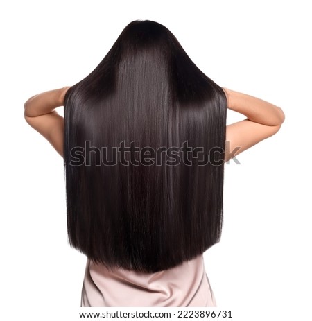 Woman with strong healthy hair on white background, back view Royalty-Free Stock Photo #2223896731