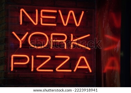 new york pizza red neon sign on black