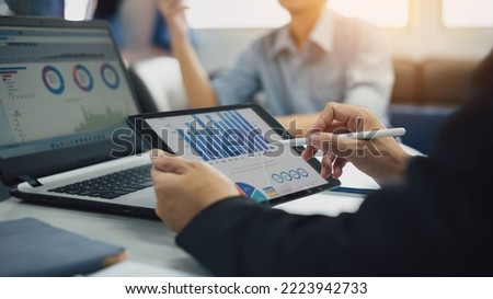 Two businessman consult analyzing company financial cash flow result. Concept for teamwork business corporate and economy fund. Royalty-Free Stock Photo #2223942733