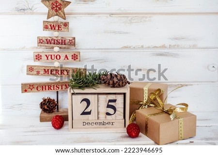 Christmas Presents ,Wooden Pine Tree and Wooden Calendar with the Date 25 December 
