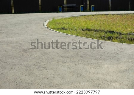 Road surface in city. Pedestrian area. Empty asphalt. Street in summer. Blank track.