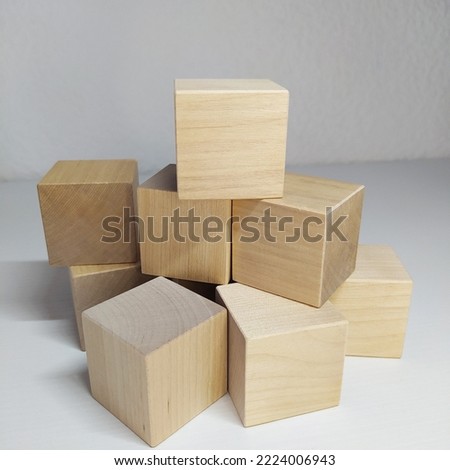 Wooden blocks 3d, 8 pieces, toy cubes, pyramid. Mathematical account. Business, strategic creative material or idea template on white background