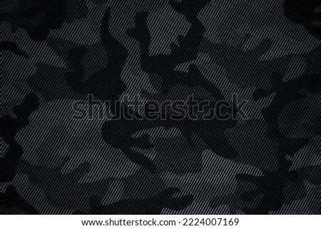 Camouflage pattern. Trendy dark gray camouflage fabric. Military texture. Dark background. Royalty-Free Stock Photo #2224007169
