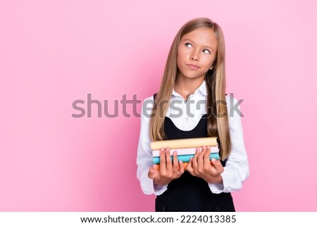 Photo of clever schoolchild deep think solving lecture task hold book isolated on pastel color background