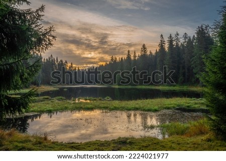 Autumn morning in Jizerske mountains with sun and mist in north Bohemia