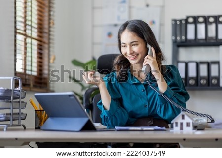 house model with business woman signs a purchase contract or mortgage for a home, buy and sell home insurance concerning mortgage loan Real estate concept.