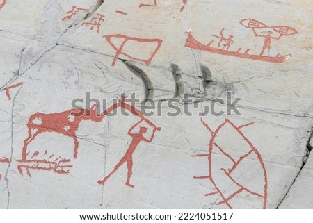 Prehistoric rock carvings with animals and people, protected by Unesco, in Alta, Norway