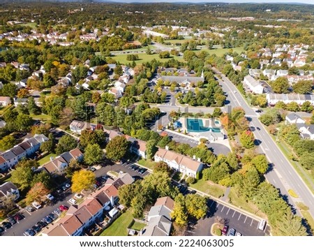 Aerial view of upscale residential area, gated community street real estate with single family homes. Autumn sunny day. Royalty-Free Stock Photo #2224063005