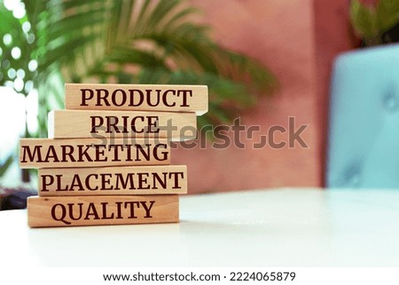 Wooden blocks with words 'product, price, marketing, placement, quality'. product sale