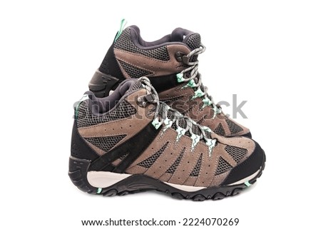women's trekking boots on a white background.hiking boots with elastic soles. shoes for travel and tourism. Royalty-Free Stock Photo #2224070269