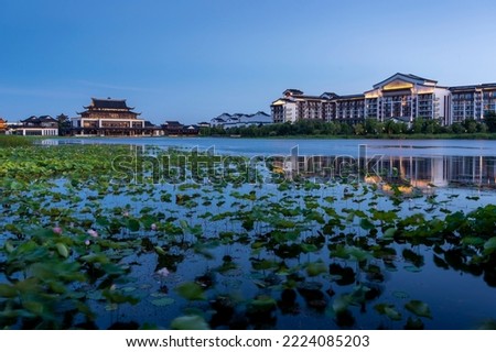 Chinese style buildings by the lake in the evening