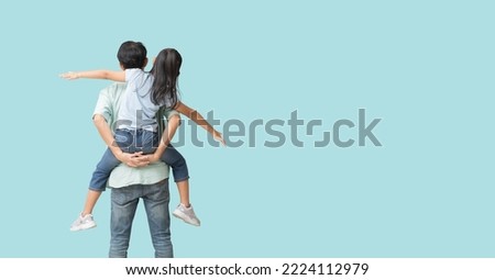 Happy asian family of father and daughter hug spread out your arms, Back view isolated on blue background with Clipping paths for design work empty free space Royalty-Free Stock Photo #2224112979