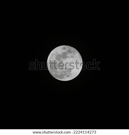 The​  full moon in the dark sky 
