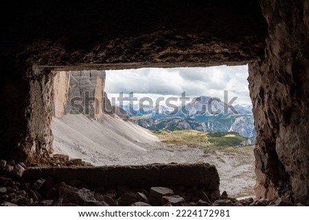 View through an old embrasure in an alpine fortress of the World War I, marking the former Austro-Italian frontier in the Dolomites, South Tirol Royalty-Free Stock Photo #2224172981