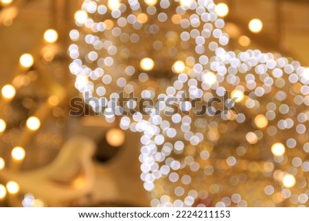 The close-up of lighting decoration, blurred lighting in gold and white color