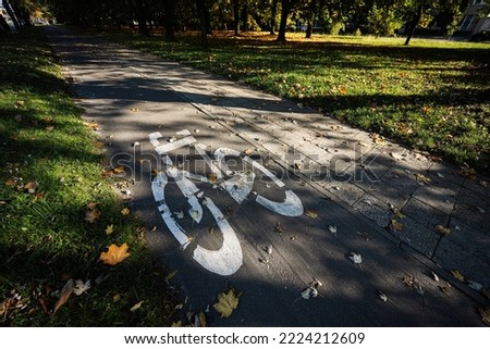 Symbol of bike path in the autumn park. 