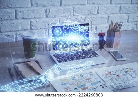 Double exposure of desktop computer and technology theme hologram. Concept of software development.