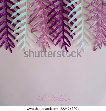 Christmas composition. Pink, purple and white Christmas decoration on pink table background. Flat lay, top view, copy space. New Year sale card. Pink Christmas.