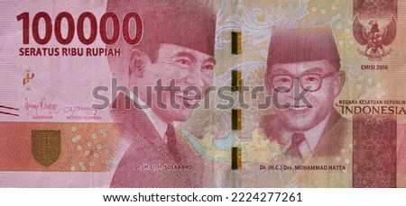 Indonesian rupiah banknotes series with the value of one hundred thousand rupiah IDR 100000 issue 2016. One hundred thousand rupiahs Royalty-Free Stock Photo #2224277261