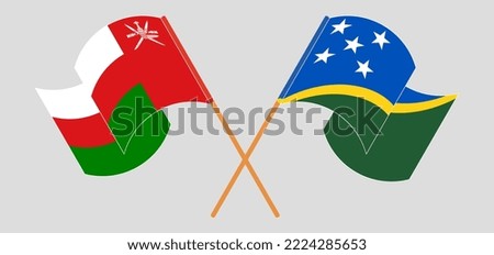 Crossed and waving flags of Oman and Solomon Islands. Vector illustration
