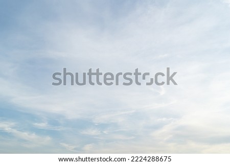 Beautiful blue sky bright midday sun with fluffy clouds. Summer sunshine with white cloudscape background. Natural scenic sunny day horizon sky wallpaper backdrop. Royalty-Free Stock Photo #2224288675