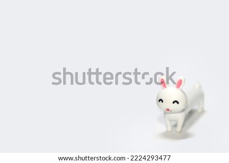 white toy rabbit on a white background