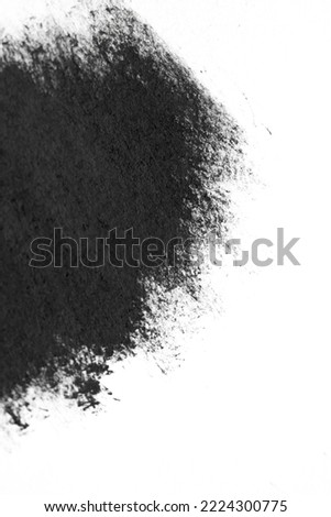 Brush strokes of black acrylic paint close-up. Edge of Smeared Acrylic Black Spot isolated on white background. Abstract creative background. Art drawing texture concept. Copy space, space for text