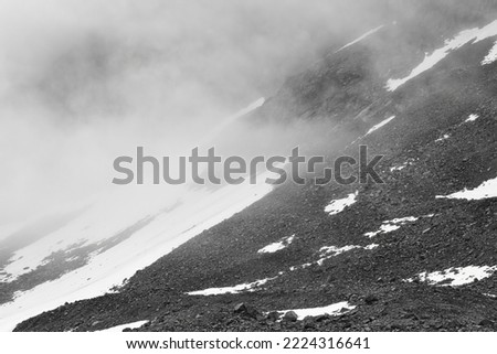 View on the glacier forelands during foggy misty day of Rabots glacier in Tarfala region in alpine part of Sweden