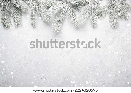 Merry Christmas and Happy Holidays greeting card, frame, banner. New Year. Noel. Snow christmas tree light background. Winter xmas holiday theme. Flat lay	 Royalty-Free Stock Photo #2224320595