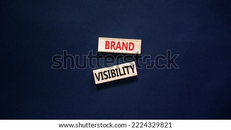 Brand visibility symbol. Concept words Brand visibility on wooden blocks. Beautiful black table black background. Business branding and brand visibility concept. Copy space.