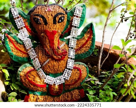Ganesha statue placed in my garden made out of coconut shell    