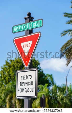 Yield sign at a traffic circle roundabout Bonaventure Blvd Weston FL