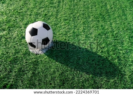 football player set ball football on grass at penalty point for shoot or kick to win a score in international league football match