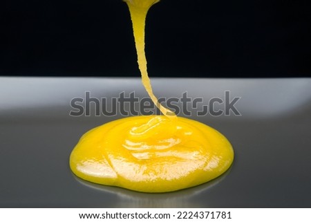 Fresh viscous floral honey flows onto the plate. vitamin organic food Royalty-Free Stock Photo #2224371781