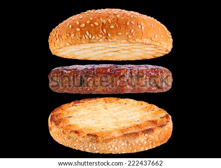 Bun and pork patty ingredient hamburger isolated on black background