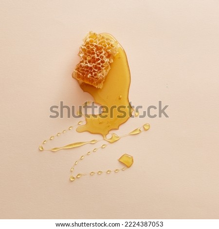 Honey Comb and honey nectar Smear Isolated Top Down Royalty-Free Stock Photo #2224387053