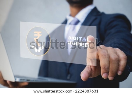 Digital rupee concept, businessman touching virtual screen of Indian digital rupee, Central bank digital currency, CBDC India. Royalty-Free Stock Photo #2224387631