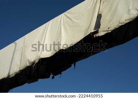 Design above track. Advertising design over road. Place for banner. White awning on billboard.