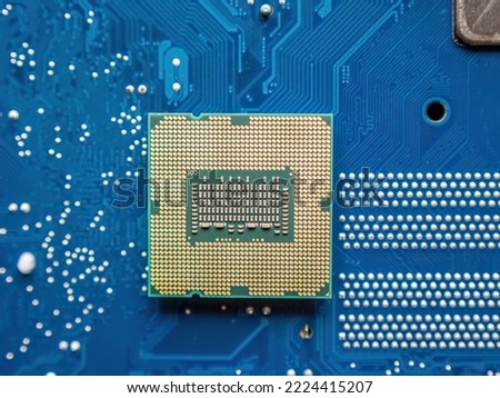 Details of a computer board with microchip as concept background Royalty-Free Stock Photo #2224415207