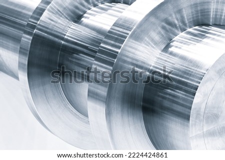 Metal shaft detail closeup, industrial metalworking concept background Royalty-Free Stock Photo #2224424861