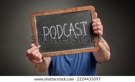 podcast white chalk blackboard sign held by a person, education, presentation and business communication concept
